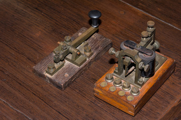 The old telegraph on wooden table