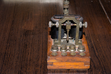 The old telegraph on wooden table