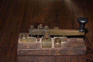 The old telegraph on wooden table