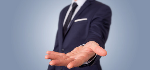 Empty holding hands of a businessman at the office