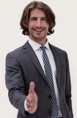 Businessman offering handshake to you on white background