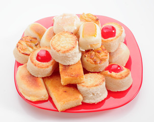 group of marzipan in red tray isolated on white
