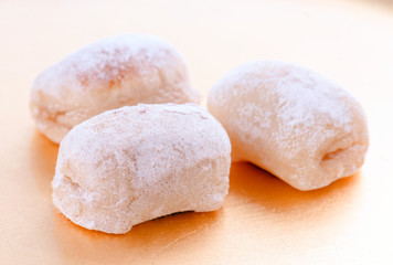 macro approach shot of marzipans in golden board