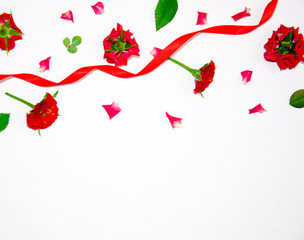 rose petals and buds and red ribbon
