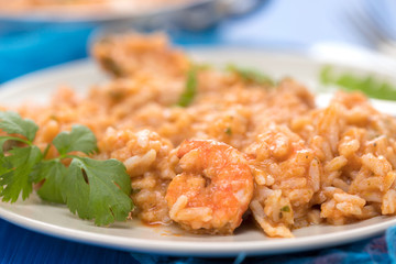 rice with fish and seafood on plate
