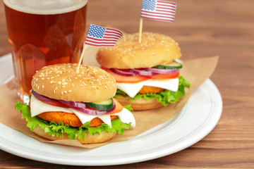 Fast food, homemade burger on a wooden background
