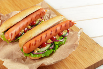 Hot dogs on wooden background