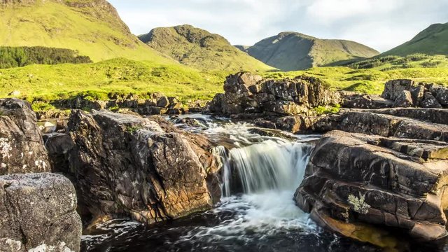 Dolly shot time lapse with long time exposure of the paradisal waterfall landscape in Glen Etive, Scotland - United Kingdom