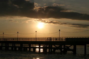 Fototapeta na wymiar sunset pier sea water