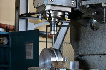 Milling the workpiece with the cnp in the work process. Manufacture of metal products.