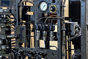 Fototapeta premium Hydraulics oil station on the machine tool on industrial equipment. Lubrication system with oil under pressure.