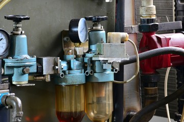 Hydraulics oil station on the machine tool on industrial equipment. Lubrication system with oil under pressure.