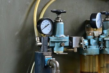 Hydraulics oil station on the machine tool on industrial equipment. Lubrication system with oil under pressure.