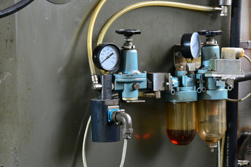 Hydraulics oil station on the machine tool on industrial equipment. Lubrication system with oil under pressure.