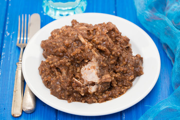 rice with rabbit on dish on wooden background