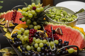 Wedding buffet with fresh exotic fruits: kiwi, grapes, watermelon