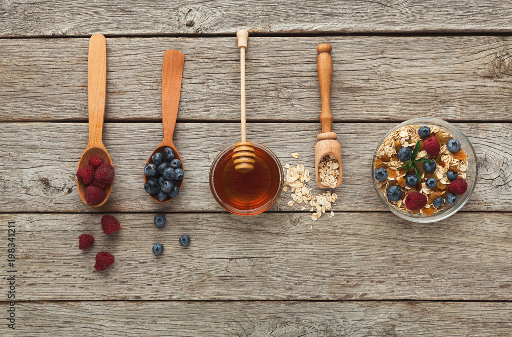 Wall mural healthy morning meals background. tasty ingredients in wooden sp