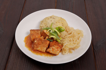 Tofu with cabbage and rice dumplings  on a table