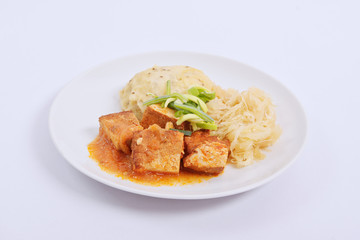 Tofu with cabbage and rice dumplings  on a white