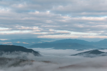 Beautiful landscape  view of misty in morning over the mountain  at sunrise time