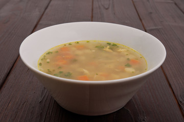 Tasty bread soup with vegetables on a table