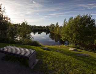 A bench by the water in evening. Finland