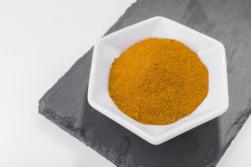 turmeric powder in container - curcuma longa
