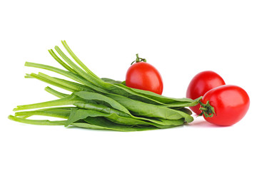 Bunch of green spinach and red tomatoes