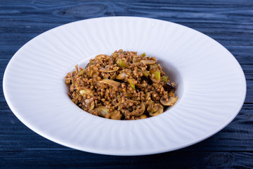 spinach, mushrooms buckwheat on a gray background. toning. selective Focus