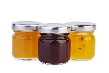 Three glass jars with different jam