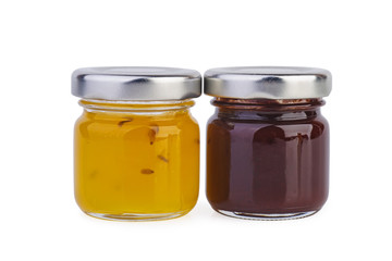Glass jar with orange and plum jam