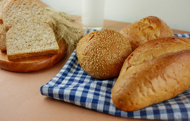 Various bread and milk on brown background  Food,bakery concept