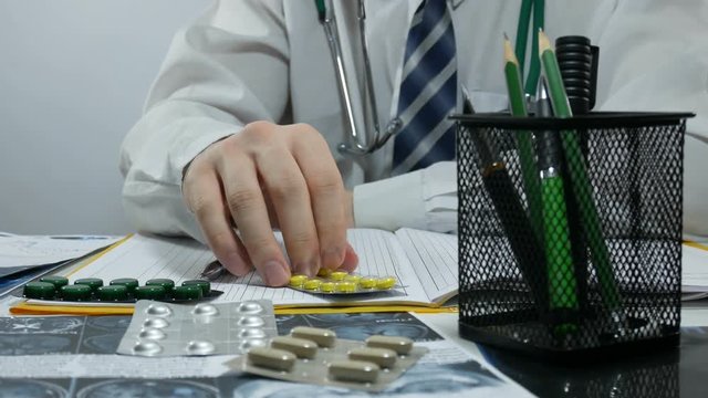 male doctor writing prescription