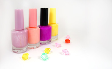 collage, nail varnishes and multi-colored rhinestones.