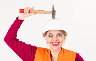 Beautiful engineering woman using hammer and tools