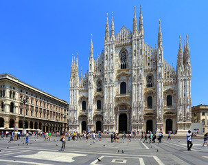 Italy, Milan - Exterior view of the Cathedral of St. Mary Nascente - Duomo Santa Maria Nascente di Milano at Piazza del Duomo - Cathedral Square - obrazy, fototapety, plakaty