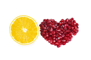 Heart made from pomegranate berries and orange slice