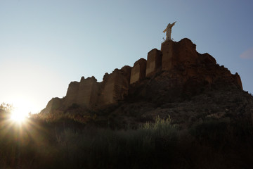 The statue of Jesus Christ on a mountain on a fortress in Spain