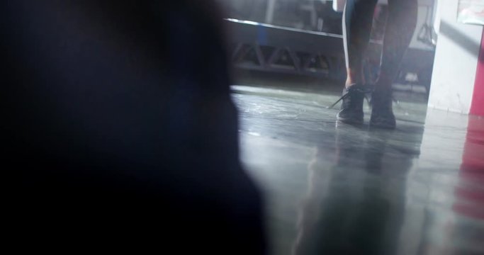 Young woman's feet with trainers while skipping a jump rope