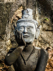 Fototapeta na wymiar Bangkok, Thailand - Circa January 2018: Statue depicting a Reusi Dat Ton (Thai Yoga) pose at famous Wat Pho (Buddhist Temple)