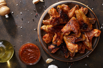 Barbecued chicken wings with bbq sauce on the plate. - 198360682
