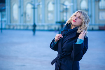 Concept of life modern woman in big city, lifestyle citizen peoples, lady at spring or autumn day. Middle age woman in coat and scarf walk around center streets 
