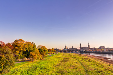 Naklejka premium Historic old town of Dresden in autumn with colorful trees and leaves