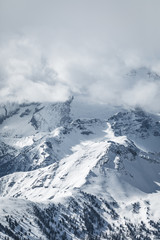Cloud covered mountain formation in the Italian alps, Italy