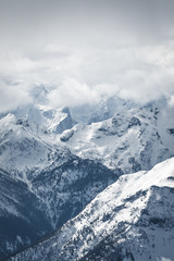 Cloud covered mountain formation in the Italian alps, Italy