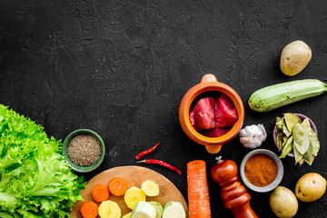 ingredients for vegetable ragout cooking on stone table background top view mock-up