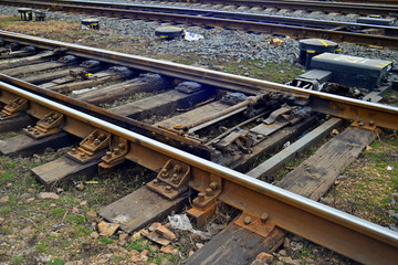 The railway is wide. Rails and paths close-up.