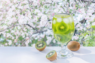 Drink of kiwi in a glass .