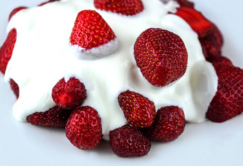 fresh strawberry with cream close-up.