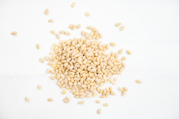 Shelled Raw Pine Nuts on light background